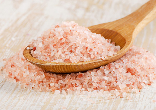 pink salt in a wooden spoon